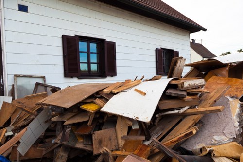 Workers safely handling construction debris